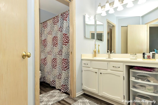 bathroom with vanity and hardwood / wood-style floors