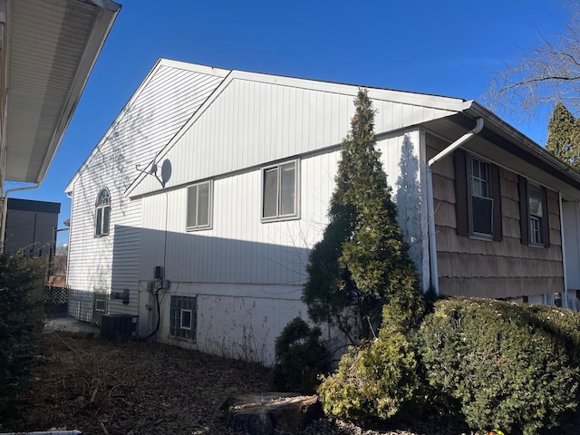 view of side of home with cooling unit