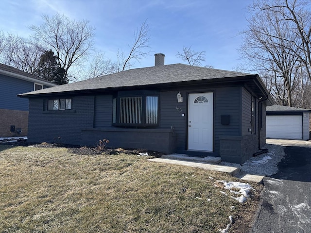 single story home with a garage and a front yard