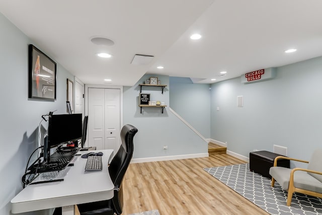 home office with hardwood / wood-style floors