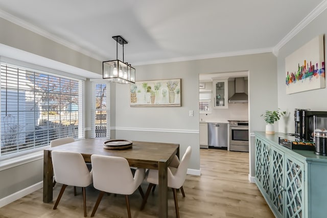 dining space with a notable chandelier, crown molding, and light wood-type flooring