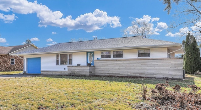 ranch-style home with a garage and a front yard