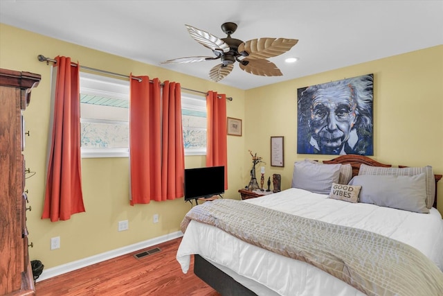 bedroom featuring hardwood / wood-style flooring and ceiling fan