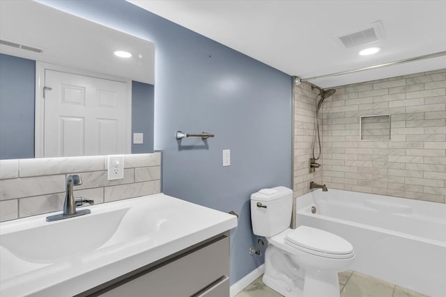 full bathroom with vanity, tiled shower / bath, and toilet