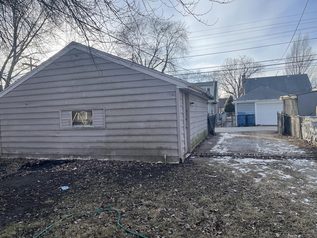 view of side of home featuring a garage