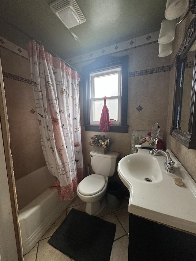 full bathroom featuring toilet, vanity, shower / bathtub combination with curtain, and tile patterned flooring