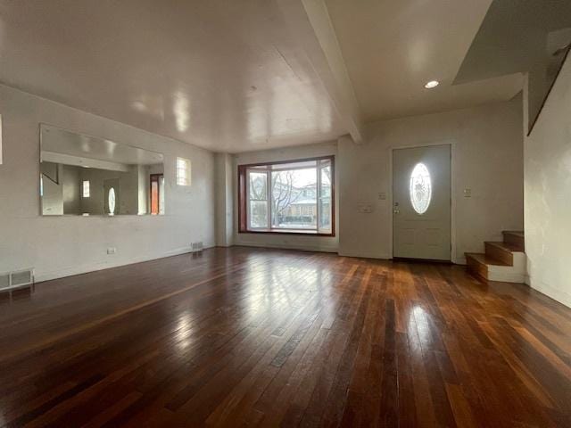 entryway with dark hardwood / wood-style flooring