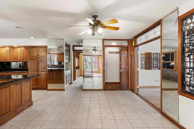 kitchen featuring ceiling fan and light tile patterned flooring