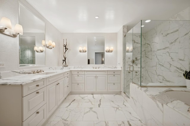 bathroom with vanity and a shower with shower door