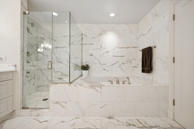 bathroom featuring vanity and separate shower and tub