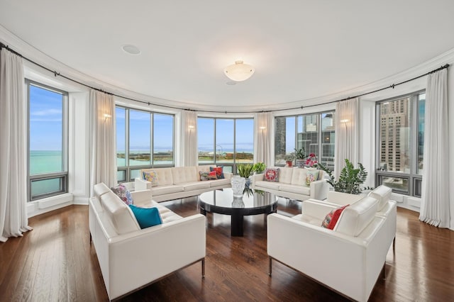 sunroom / solarium featuring plenty of natural light and a water view