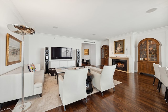 living room with crown molding and wood-type flooring