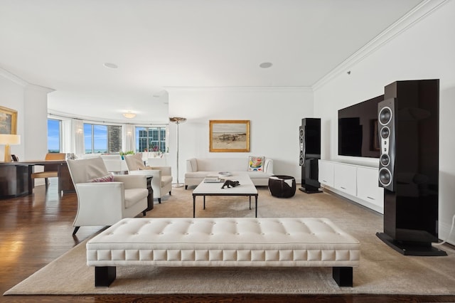 living room featuring ornamental molding and wood-type flooring