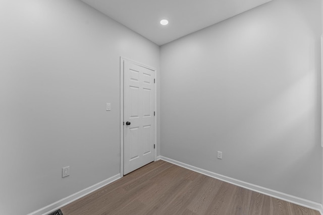 empty room with wood-type flooring