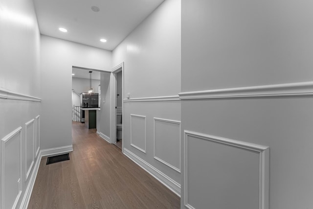 hallway featuring wood-type flooring