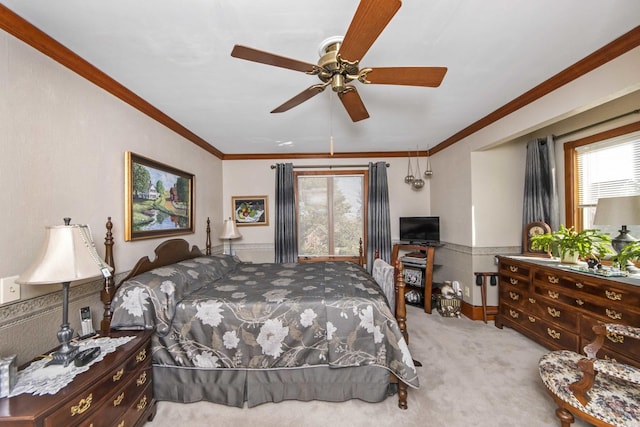 bedroom featuring ornamental molding, light colored carpet, and ceiling fan