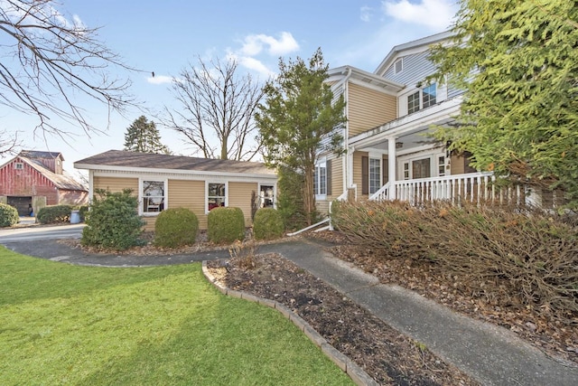 view of home's exterior with a yard