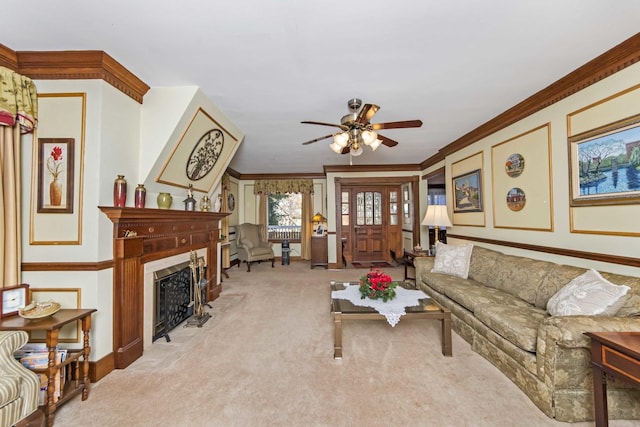 living room with crown molding, light colored carpet, and ceiling fan