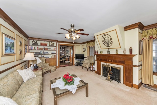 living room featuring crown molding, light colored carpet, and ceiling fan