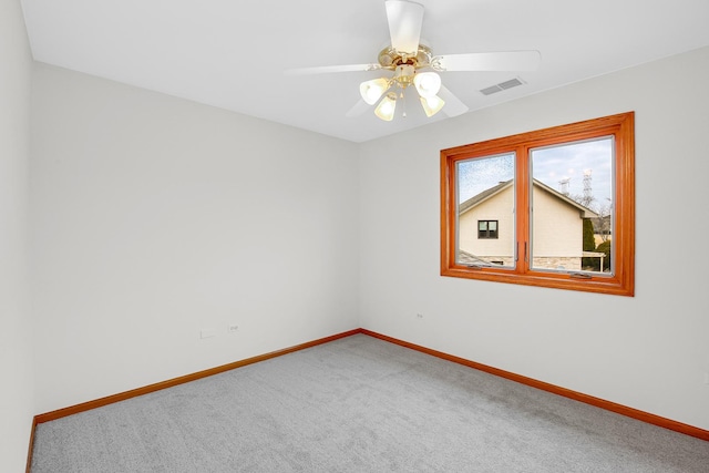 carpeted empty room with ceiling fan