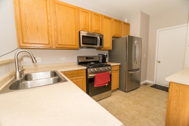 kitchen featuring appliances with stainless steel finishes and sink