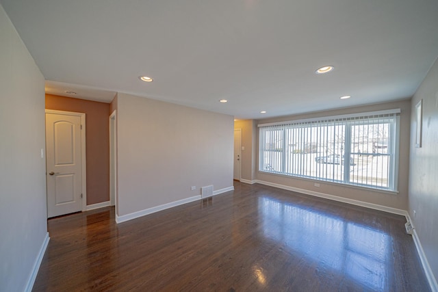 empty room with dark wood-type flooring