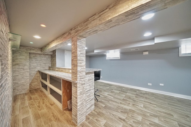 basement featuring light hardwood / wood-style flooring