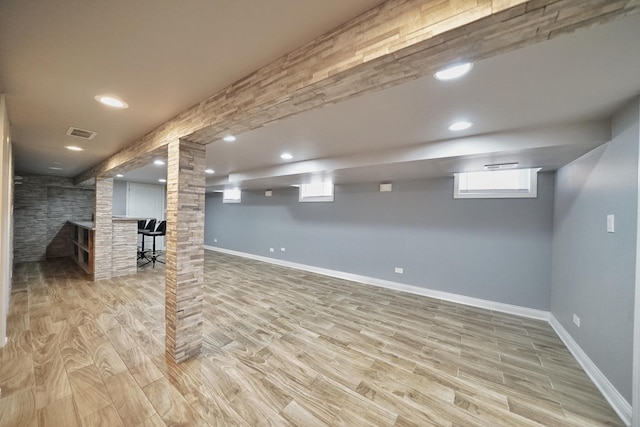 basement featuring light hardwood / wood-style flooring