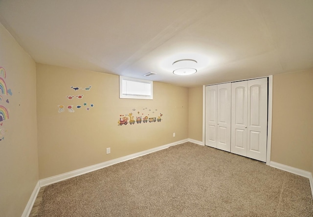 unfurnished bedroom with carpet and a closet