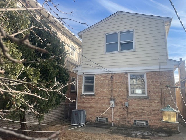 rear view of house with central air condition unit