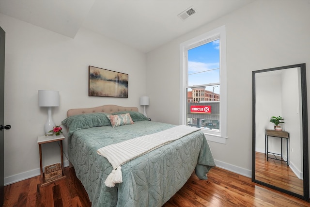 bedroom with hardwood / wood-style floors