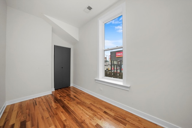 empty room featuring wood-type flooring