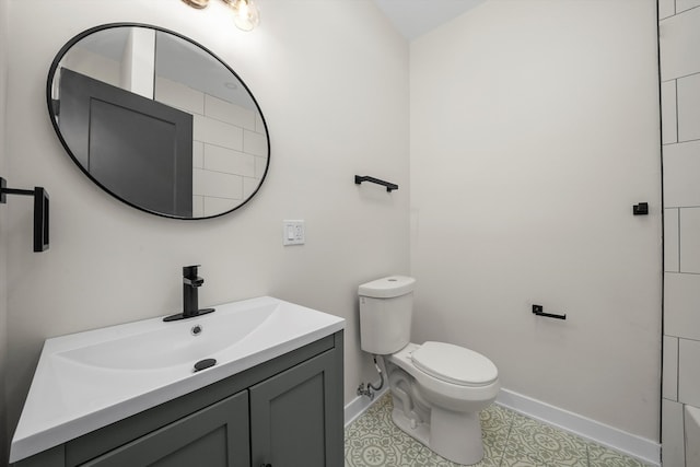 bathroom with tile patterned floors, vanity, and toilet