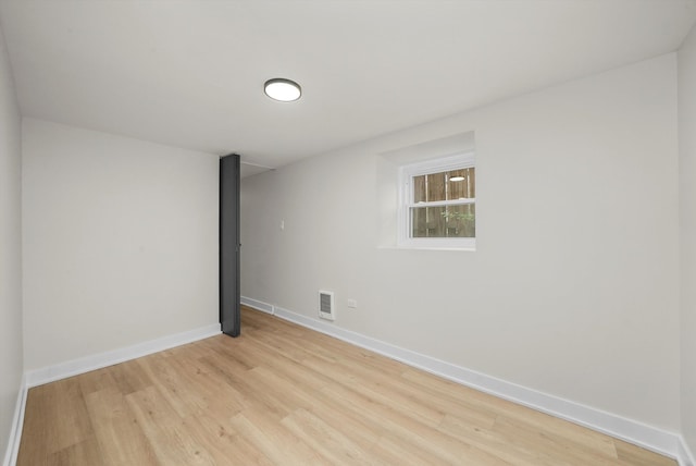 spare room with light wood-type flooring