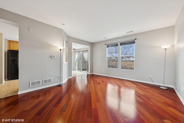 unfurnished living room featuring hardwood / wood-style floors