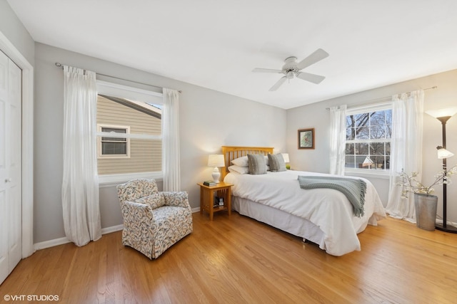 bedroom featuring hardwood / wood-style flooring, a closet, and ceiling fan