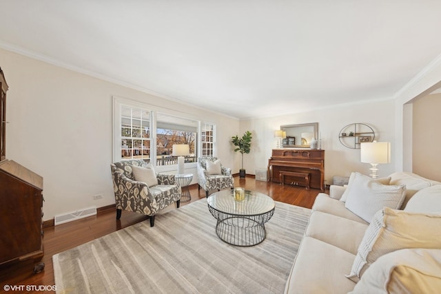 living room featuring ornamental molding and dark hardwood / wood-style floors