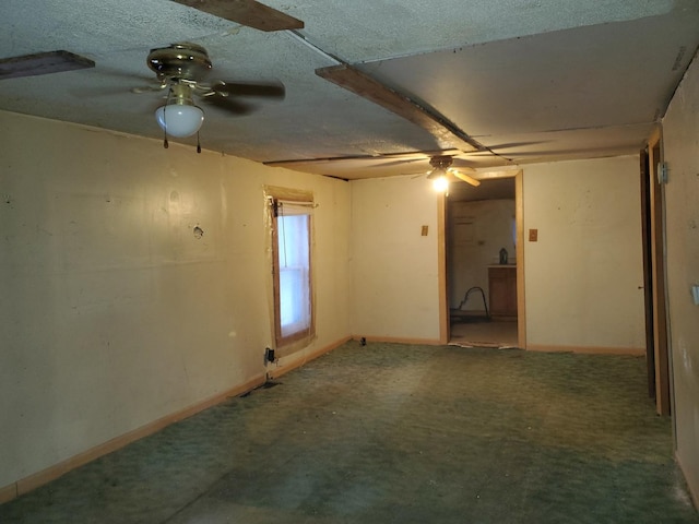 unfurnished room with a textured ceiling and ceiling fan