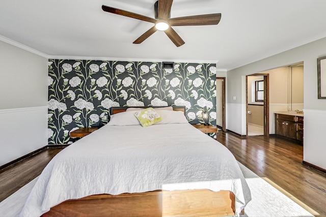 bedroom with dark hardwood / wood-style flooring, connected bathroom, ornamental molding, and ceiling fan