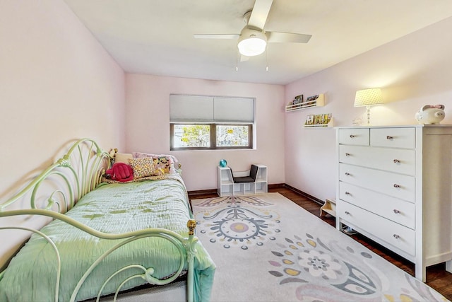 bedroom featuring dark wood-type flooring and ceiling fan