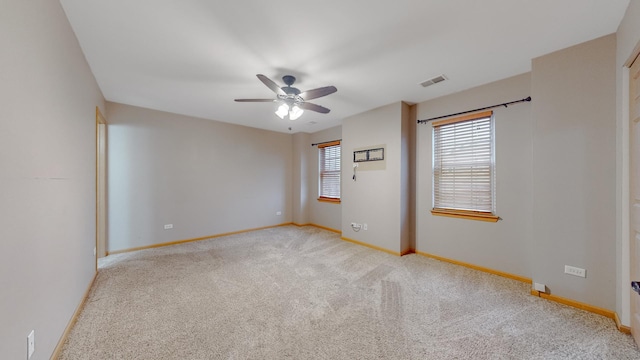 carpeted empty room featuring ceiling fan