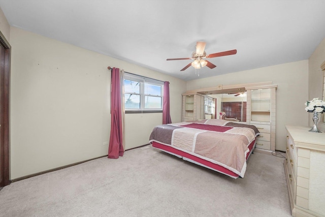 bedroom featuring light carpet and ceiling fan