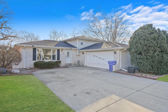 view of front of home with a garage and a front lawn