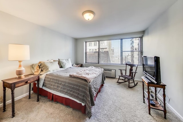 bedroom featuring carpet floors and a wall mounted AC