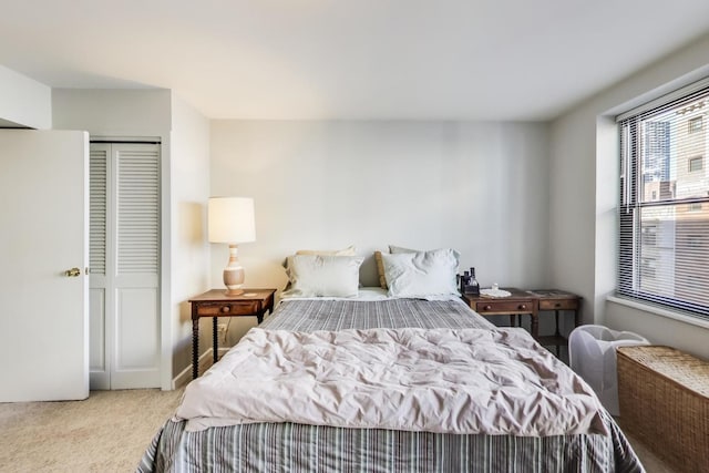 carpeted bedroom with a closet