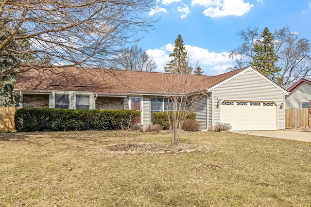 single story home featuring a front yard, fence, driveway, an attached garage, and brick siding