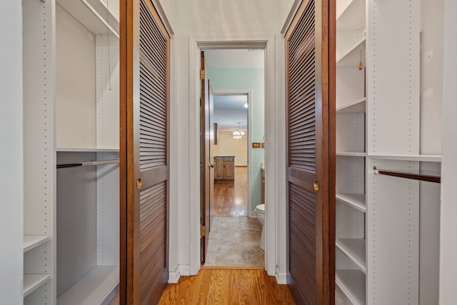 hallway with light wood-type flooring