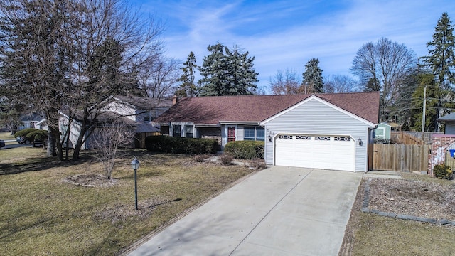 single story home with a shingled roof, fence, a front yard, a garage, and driveway