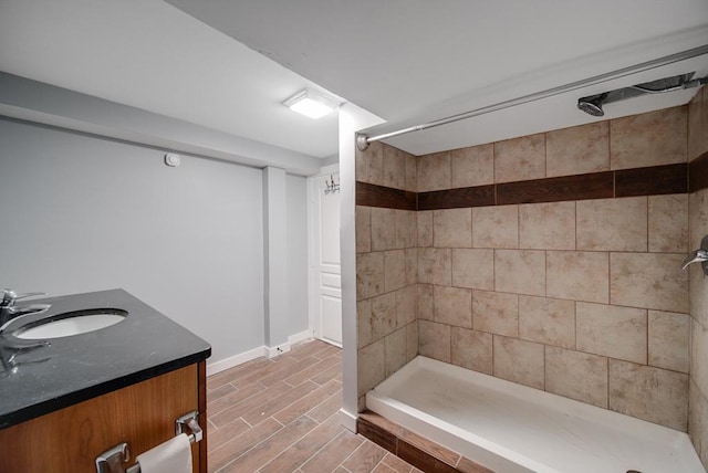 bathroom with vanity and a shower