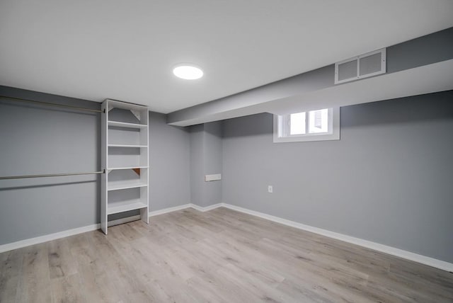 basement with light wood-type flooring